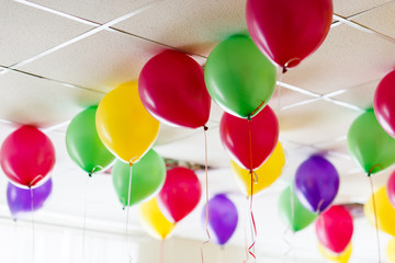 Many multicolored inflatable balls in the room