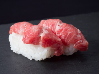 sushi set on black plate