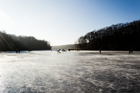Ice-skating on a sunny day, Schlachtensee, Berlin, Germany