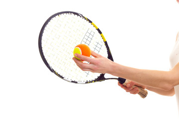 Woman with tennis racquet and ball