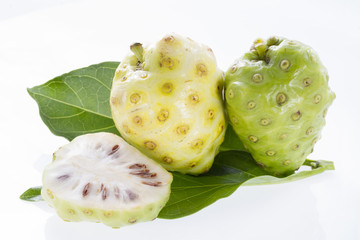 Fototapeta na wymiar Noni fruits isolated on white background - Morinda citrifolia