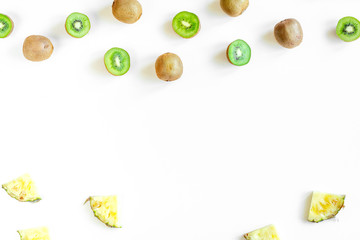 Fototapeta na wymiar exotic fruit design with kiwi on white background top view mock up