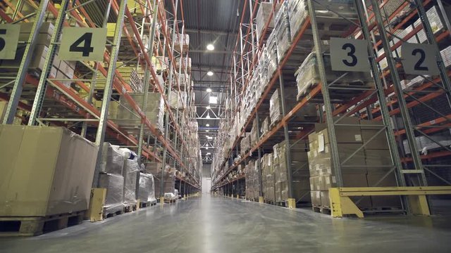 Interior of warehouse with racks full of cardboxes
