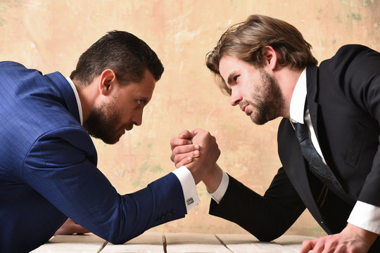 partnership and teamwork, arm wrestling of businessman and compete man