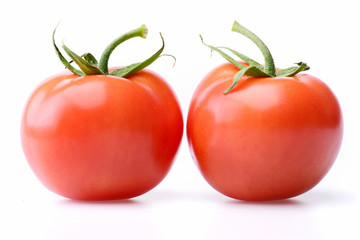 Tomatoes. Red ripe vegetable plant isolated on white