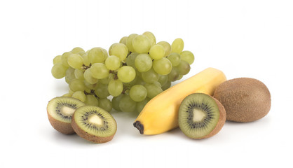 Green grapes, kiwi and bananas on a white background