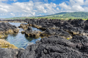 Seascape with black lava rocks and natural swimming pools in Biscoitos, Terceira, Azores, Portugal
