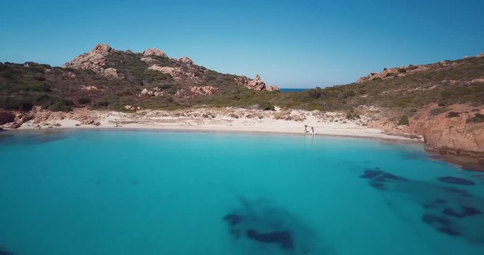 Aerial video of a paradisiac beach on the island of Mortorio in Sardinia, incredible island of the Emerald Coast in Italy..