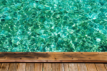 Wooden pier with crystal water