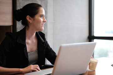 Beautiful young businesswoman is working a presentation