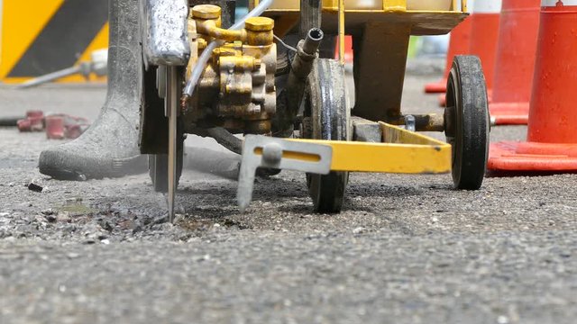 Road construction with an asphalt cutter
