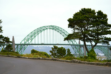 Arched bridge connecting shores bay of Pacific Ocean Newport Oregon