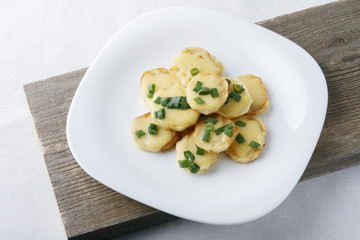 Appetizer of potatoes, cheese and green onions. There is room for text