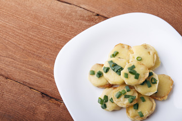 Appetizer of potatoes, cheese and green onions. There is room for text