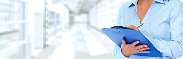 Business woman hands writing clipboard