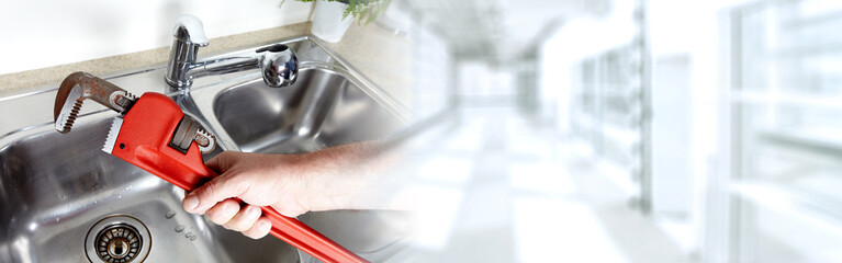 Plumber with wrench.