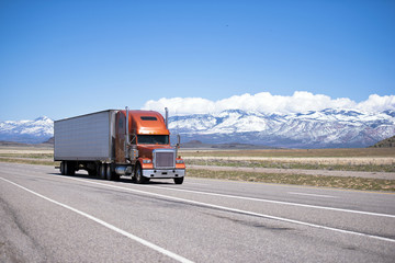 Big classic well maintained semi truck on high way © vit