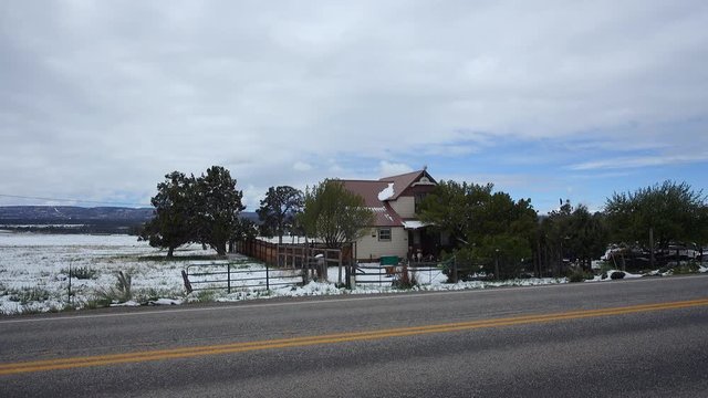 A daytime wintry establishing shot of a Colorado suburban home.  	