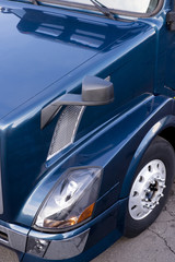 Dark blue semi truck side view fragment