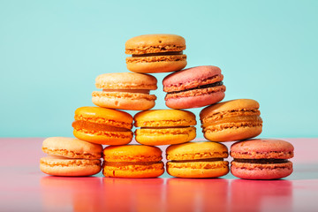 Stack of macarons on pastel background