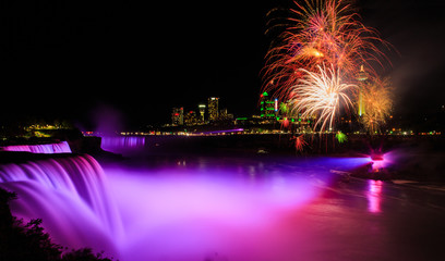 Niagara Falls night time illuminated with fireworks