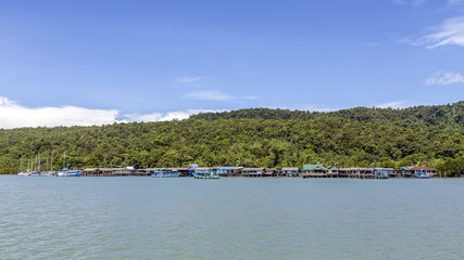 Fototapeta na wymiar Traditional Thai fisherman's village on koh Chang island in sunny day and clear blue sky. Koh chang Is the second largest island of Thailand.