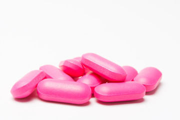 Obraz na płótnie Canvas pile of pink tablets medicine