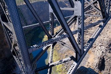 Truss bridge with rivets high above the deep gorge