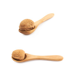 Walnut in a wooden spoon isolated