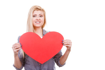 Woman holding big heart love symbol