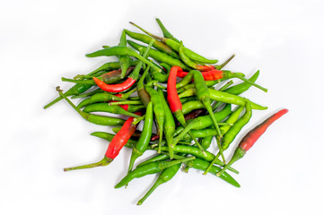 Green and red thai chilli on white background