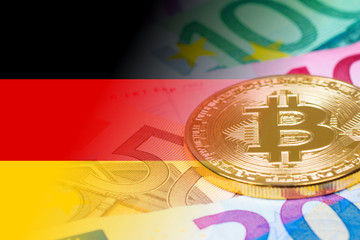 golden bitcoin metallic coin over euro banknotes with germany flag