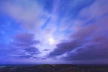 Obraz premium Full moon over the beach at night