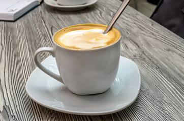 Mug with coffee on the table