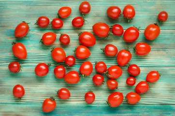 Red tomatoes background on blue