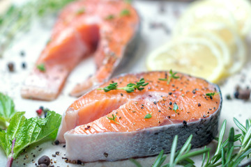 Salmon steak, thyme, rosemary, mint and pepper.