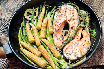 Salmon steak, fried with herbs, pepper and lemon.