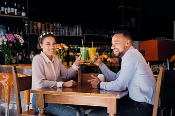 A man and a woman in a cafe.