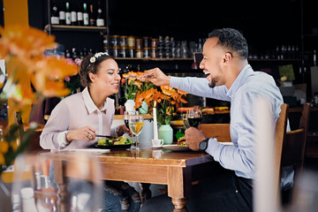 Black American male and female eating vegan food.