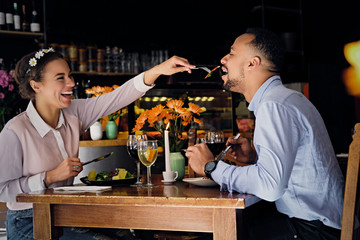 Black American male and female eating vegan food.