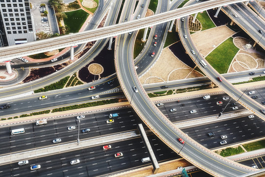 Scenic aerial view of big highway intersection in Dubai, UAE, at daytime. Transportation and communications concept.