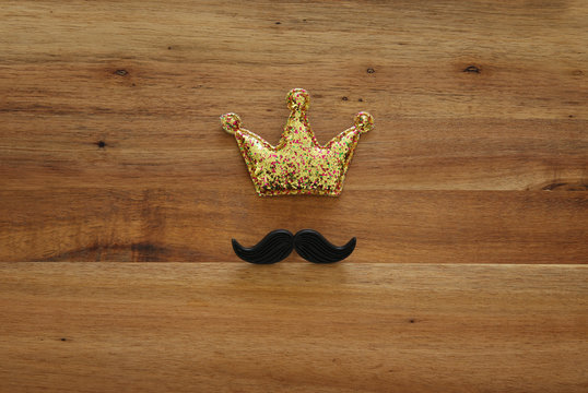 funny mustache and glitter crown. Father's day concept