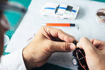 Person assembling slot car