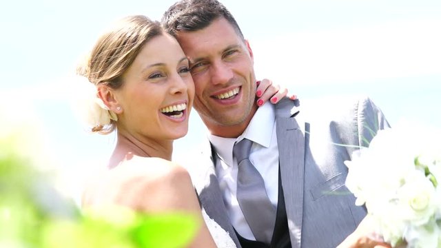 Portrait of beautiful bride and groom on their wedding day                     