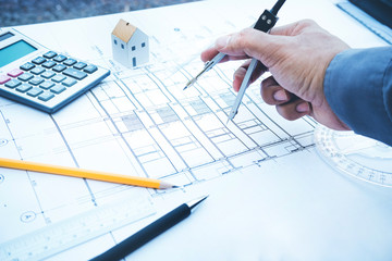 Architect working with plan design.Concepts idea of architecture,construction,engineering.