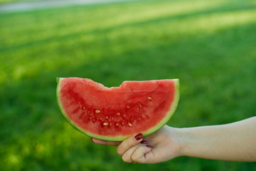 Close up of woman's hand with watermelon