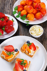 Fototapeta na wymiar tasty strawberry apricot blueberry crisp toasts