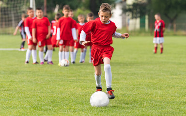 Kids soccer football - children players match on soccer field © Dusan Kostic