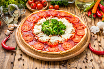 delicious italia pizza in a restaurant, on the wooden desk