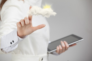 Woman with cloud and sun. Concept on the topic of computer cloud services.